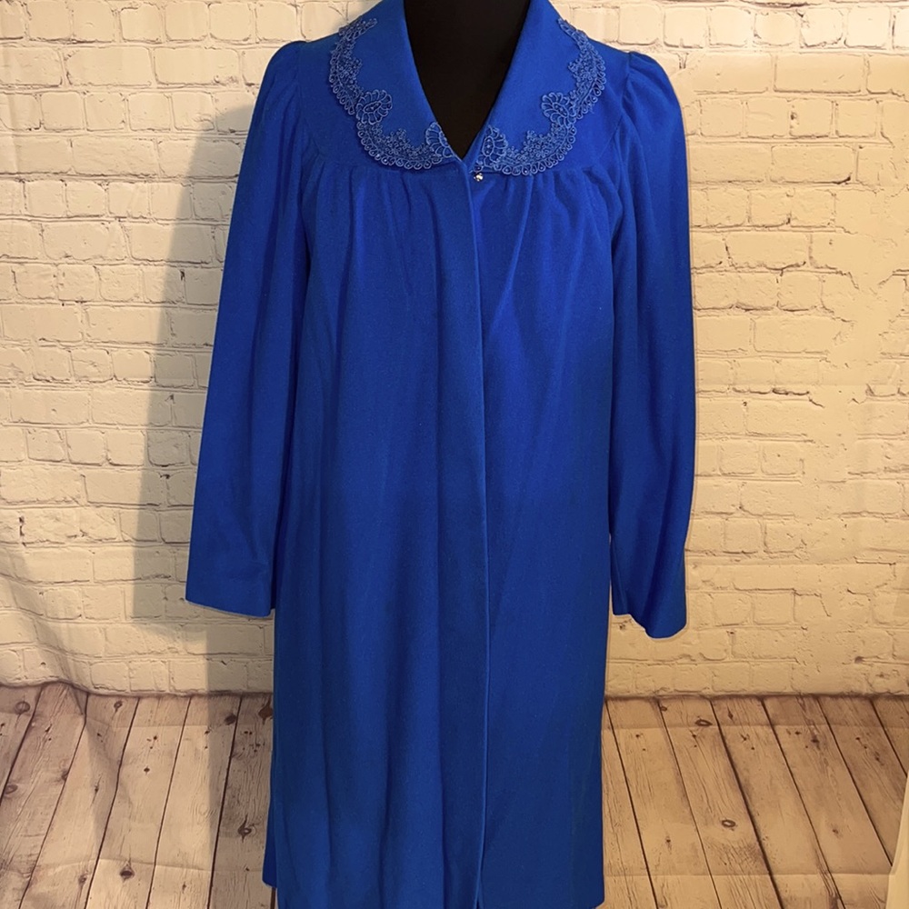 Small button down royal blue robe. Long sleeve Beautiful trim on collar Like new